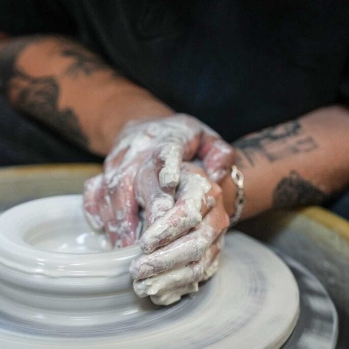 Jio Dingayan, chef de cuisine at Moneycat, throws clay as he makes a bowl at Potters Place on Wednesday, Feb. 21, 2024 in Stafford. Dingayan has joined a of chefs giving ceramics and pottery a spin, an activity that's been especially popular with foodies since the pandemic. For some chefs, it's also a way for them to put a personal stamp on their restaurants.